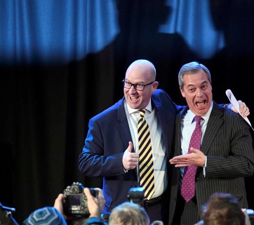 Nigel Farage embraces newly elected leader Paul Nuttall, in London. Photo: Reuters
