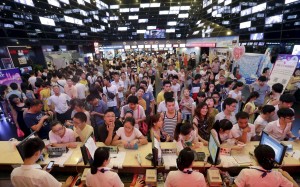 People wait for tickets at a ticket office of a movie theatre in Wuhan, Hubei province. Box office receipts were down over the National Day holiday. Photo: Reuters People wait for tickets at a ticket office of a movie theatre in Wuhan, Hubei province. Box office receipts were down over the National Day holiday. Photo: Reuters