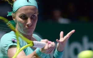 Svetlana Kuznetsova of Russia hits a return against Agnieszka Radwanska of Poland during their women's singles match at the WTA Finals tennis tournament in Singapore. Photo: AFP