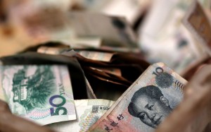 The yuan fell 1.39 per cent against the US dollar last month alone. Photo: Reuters