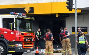 Emergency service workers at a branch of the Commonwealth Bank. Photo: Reuters