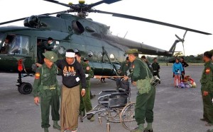 Soldiers help people injured in fighting in Lashio, northern Myanmar, on Sunday. Photo: EPA Soldiers help people injured in fighting in Lashio, northern Myanmar, on Sunday. Photo: EPA