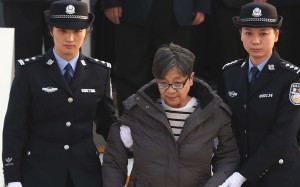 China's most wanted fugitive Yang Xiuzhu, returned to China this month and turned herself in to the authorities. The country’s anti-corruption campaign aims to now investigate the spouses and children of all Beijing city officials, Xinhua reported. Photo: Xinhua