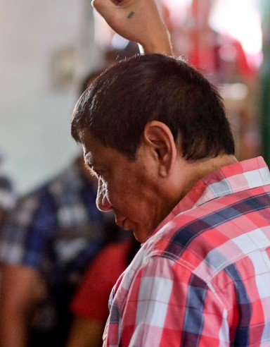Rodrigo Duterte, Mayor of Davao and presidential candidate, gestures to members of the media at a polling station during the presidential election in Davao, Mindanao, the Philippines on Monday, May 9, 2016. Photo: Bloomberg Rodrigo Duterte, Mayor of Davao and presidential candidate, gestures to members of the media at a polling station during the presidential election in Davao, Mindanao, the Philippines on Monday, May 9, 2016. Photo: Bloomberg