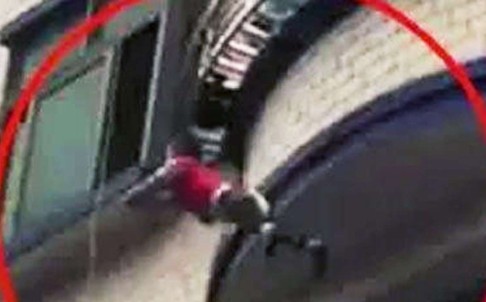 Chinese toddler Xiaojing is pictured falling from a fifth-floor balcony in Dongguan on Tuesday. Photo: Sina