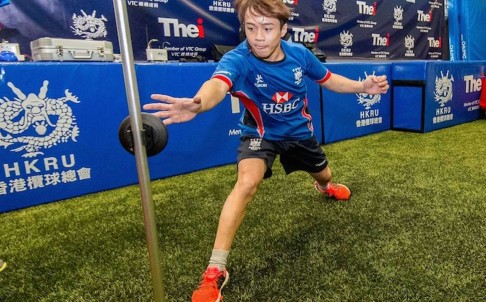 Junior ERP player Ray Li Tsz-hin of Kowloon RFC has his reaction speed measured at the THEi Junior ERP player Ray Li Tsz-hin of Kowloon RFC has his reaction speed measured at the THEi