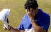 Rory McIlroy reacts as he makes bogey on the seventeenth hole. Photo: EPA