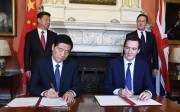 epa04987303 British Chancellor of the Exchequer George Osborne (2-R) Minister of the General Administration of Customs, Yu Guangzhou (2-L) member of the Chinese delegation during a signing ceremony on infrastructure with British Prime Minister David Cameron (R) and Chinese President Xi Jinping (L) at the British Prime Minister's London residence, 10 Downing Street, in central London, Britain, 21 October 2015. President Xi Jinping arrived in Britain on 19 October 2015 for a three-day state visit. This is the first state visit to Britain by a Chinese leader since 2005. EPA/ANDY RAIN / POOL REPEAT TRANSMISSION: ADDING OF CHINESE DELGATION MEMBER