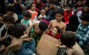 A child holds a placard reading “I want to go to Germany” in German during a protest held by migrants calling for the reopening of the borders at a makeshift camp at the Greek-Macedonian border. Germany is the most desired final destination in Europe for those fleeing war. Photo: AFP