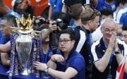 Leicester City chairman Vichai Srivaddhanaprabha (left) and vice chairman Aiyawatt Srivaddhanaprabha parade the Premier League title with manager Claudio Ranieri in a rare example of a successful Asian ownership model in the EPL. Photo: EPA