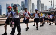 Schoolchildren in Singapore. A new study of parenting techniques in the city has discovered problems with overly intrusive parenting. Photo: AFP Schoolchildren in Singapore. A new study of parenting techniques in the city has discovered problems with overly intrusive parenting. Photo: AFP