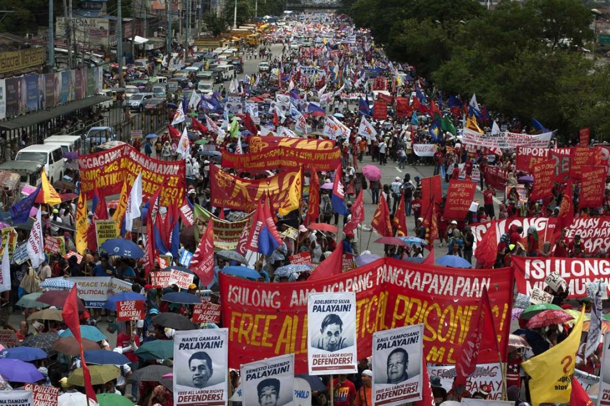 Demonstrators march to the House of Representatives to show their support for Philippine President Rodrigo Duterte ahead of his State of the Nation Address in July. Duterte used the address to announce a unilateral ceasefire with communist rebels who are waging one of Asia's longest insurgencies, and urged them to reciprocate. Photo: AFP