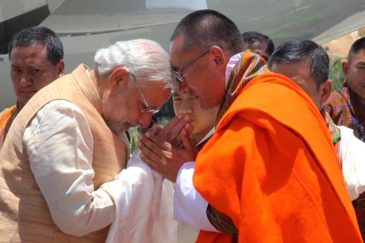 Indian Prime Minister Narendra Modi is met by Bhutanese Prime Minister Tshering Tobgay at Paro Airport in 2014, when he went to Bhutan on his first foreign trip since becoming prime minister. Photo: AFP
