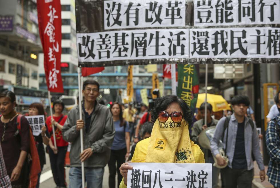 Hong Kong protesters march for ‘genuine universal suffrage’ one month ...