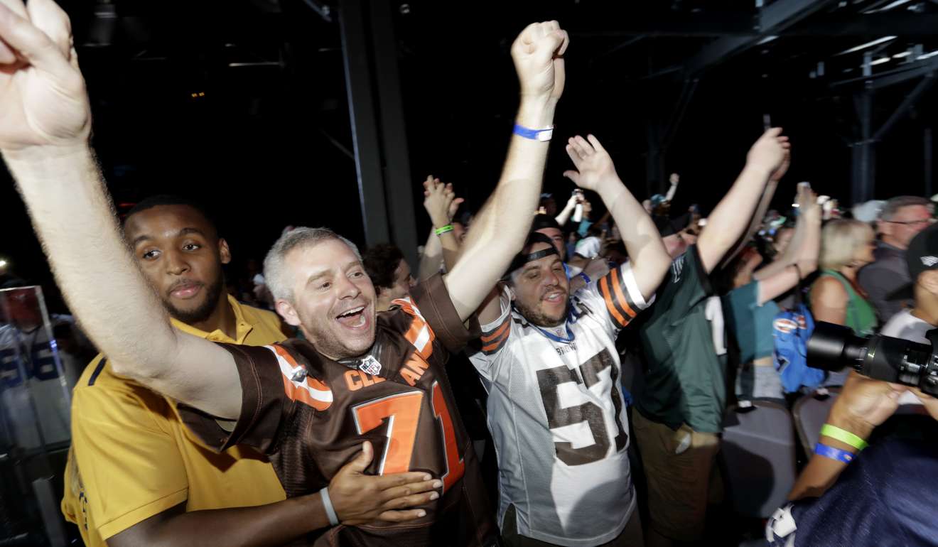 Fans cheer after Texas A&M's Myles Garrett was selected with the number one overall pick by the Cleveland Browns during the first round of the 2017 NFL football draft, Thursday, April 27, 2017, in Philadelphia. (AP Photo/Julio Cortez)
