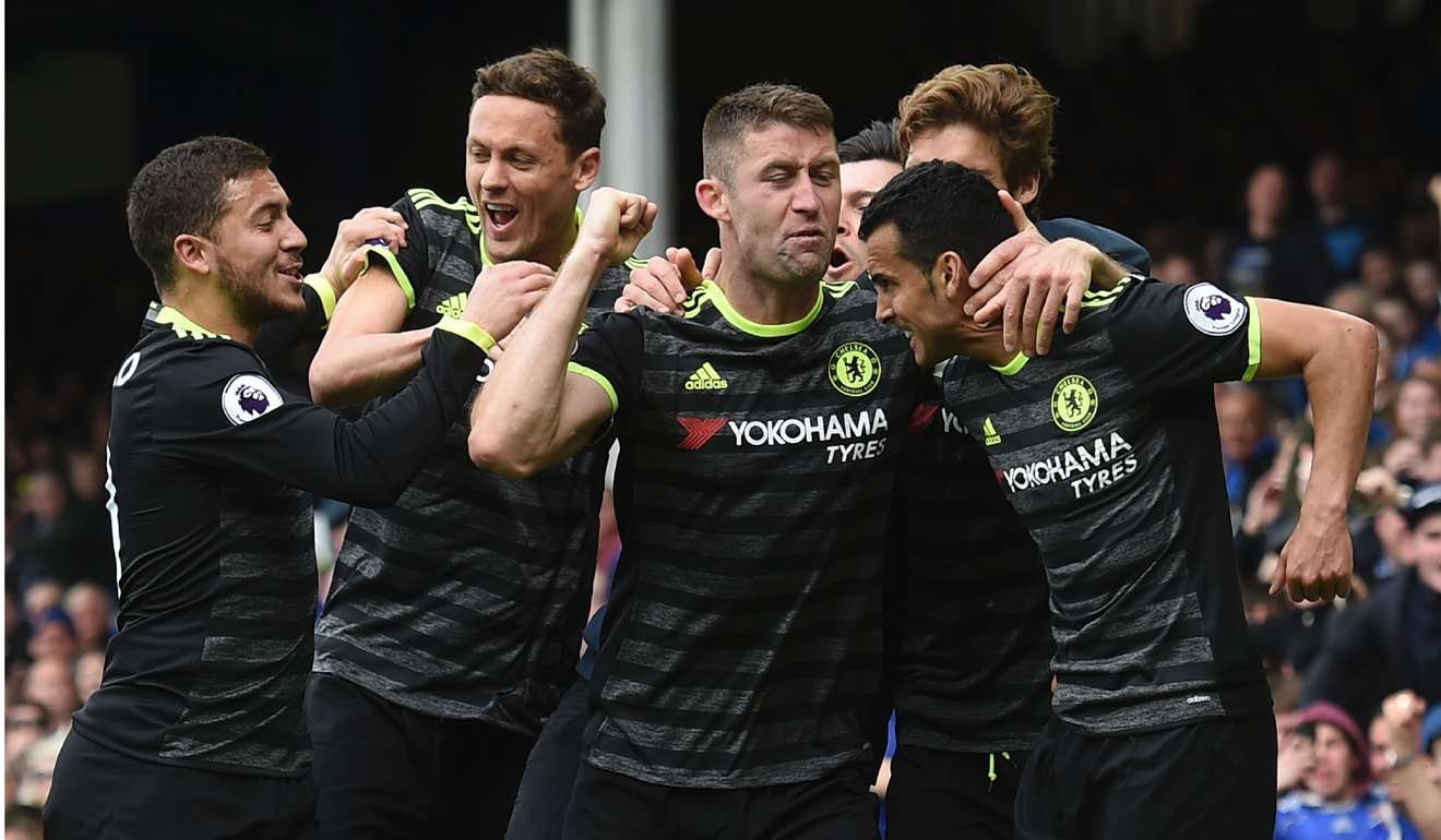 Chelsea's Spanish midfielder Pedro (right) celebrates with teammates after scoring the opening goal. Photo AFP