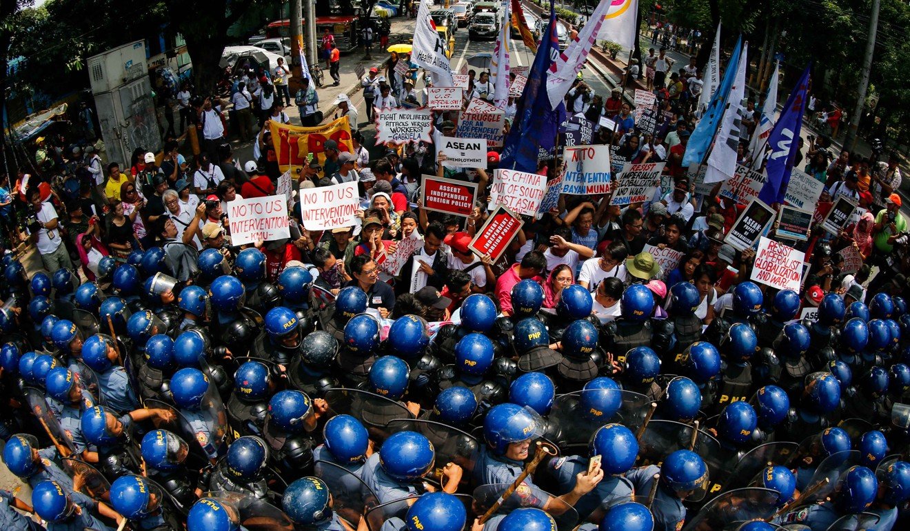 Filipino anti-riot police block protesters marching towards the vicinity of the Asean Summit venue in Manila on Saturday. In the year that Asean is celebrating its 50th anniversary, the atmosphere has been less than celebratory. Photo: EPA
