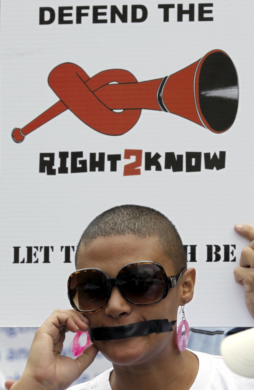 A protester covers her mouth with tape as she takes part in a silent march for free speech in Johannesburg, in 2010. South Africa is another state Garton Ash sees as influential in the debate over freedom of expression. Picture: Reuters