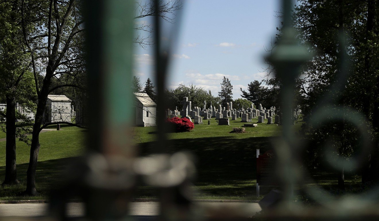 Holy Cross Cemetery is seen behind a locked gate in Yeadon, Philadelphia. The body of 19th century serial killer Dr. H. H. Holmes is being exhumed from the cemetery in suburban Philadelphia at the request of his great-grandchildren. Photo: AP