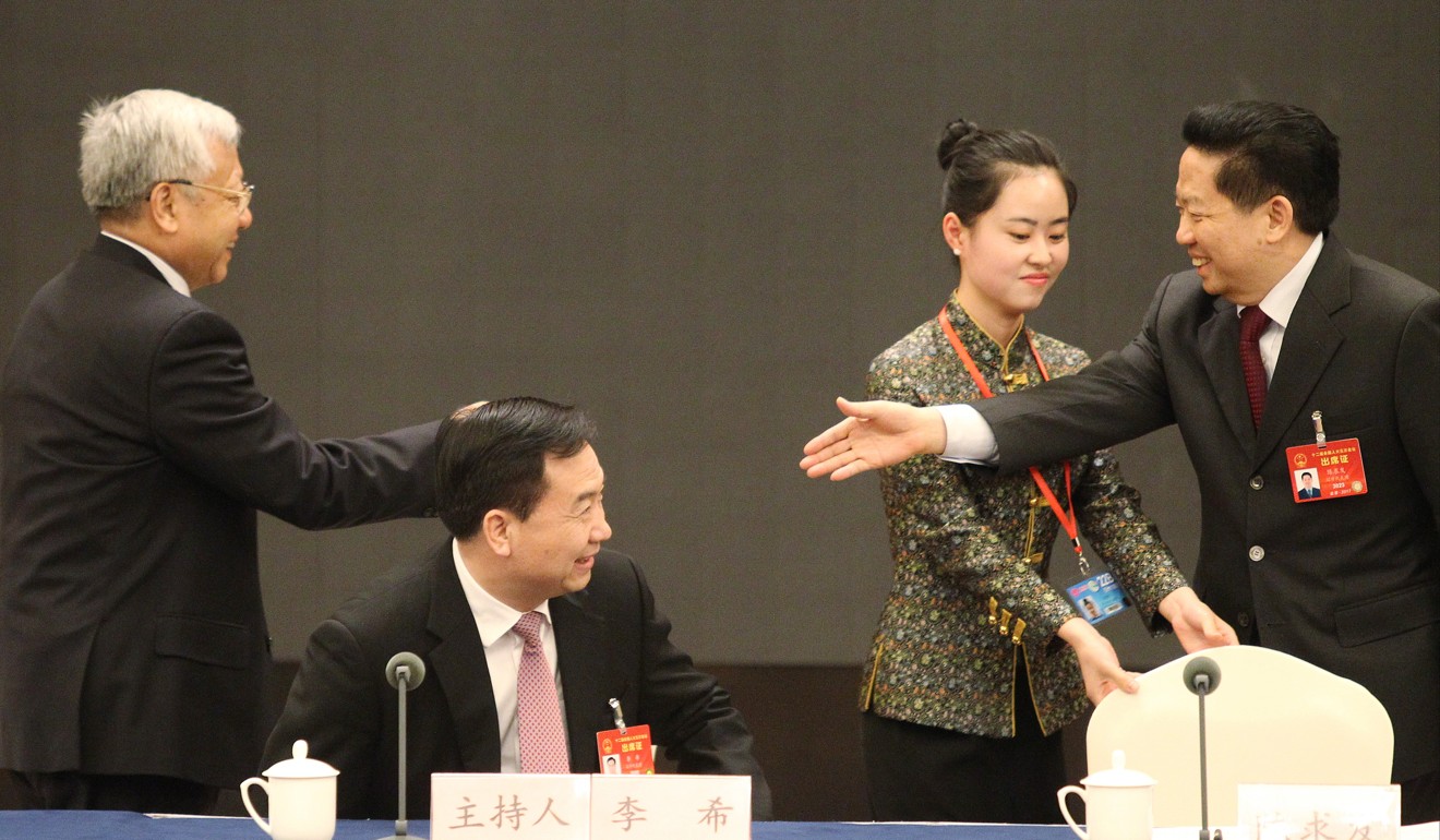 Liaoning party secretary Li Xi (centre) looks on as the province’s governor, Chen Qiufa (right), shakes hands with National People’s Congress Standing Committee member Li Jungian at meeting of Liaoning’s delegation at the annual NPC session in Beijing in March. Photo: Simon Song