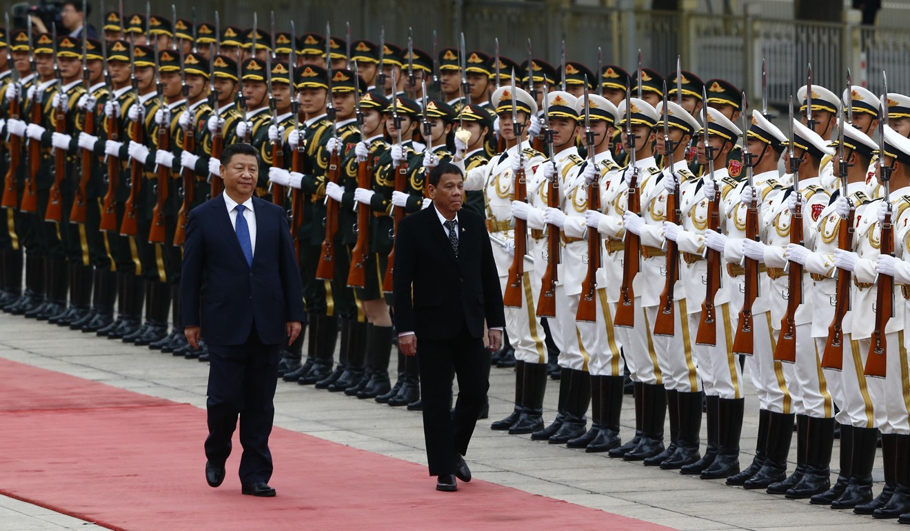 Philippine President Rodrigo Duterte (right) reviews a guard of honour with Chinese President Xi Jinping at the Great Hall of the People in Beijing in October. Photo: AFP