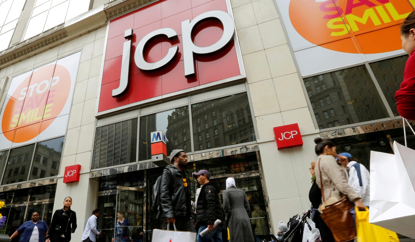 People walk past the JC Penney's store in New York as soft sales hit the US retail sector hard. Photo: Reuters
