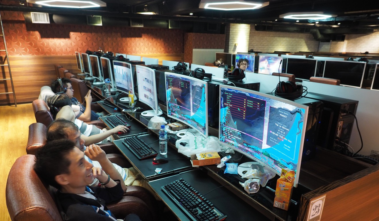 People use computers at a cyber cafe in Taipei. Photo: EPA