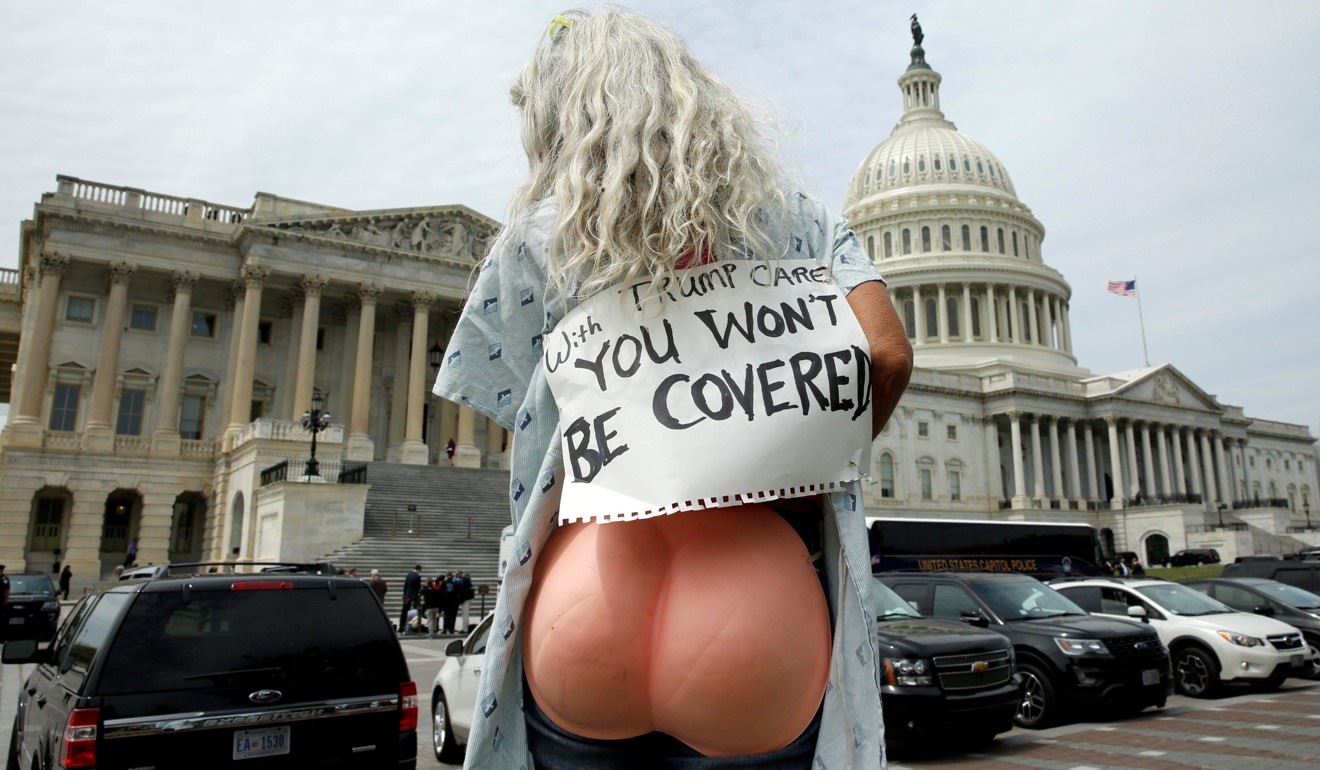 A protester makes their stance clear during voting in the US House of Representatives on the American Health Care Act, which repeals major parts of the 2000 Affordable Care Act known as Obamacare. Photo: Reuters
