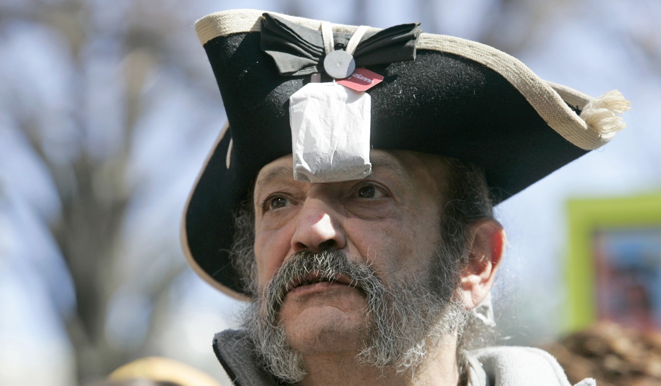 A Tea Party member attends a rally wearing a tricorn hat and a tea bag, in 2010. In the early Obama years, the Tea Party held feverish rallies where inevitably some faux live-free-or-die insurgent in a tricorn hat would hold up a placard reading, “Keep your government hands off my Medicare”. Photo: AP