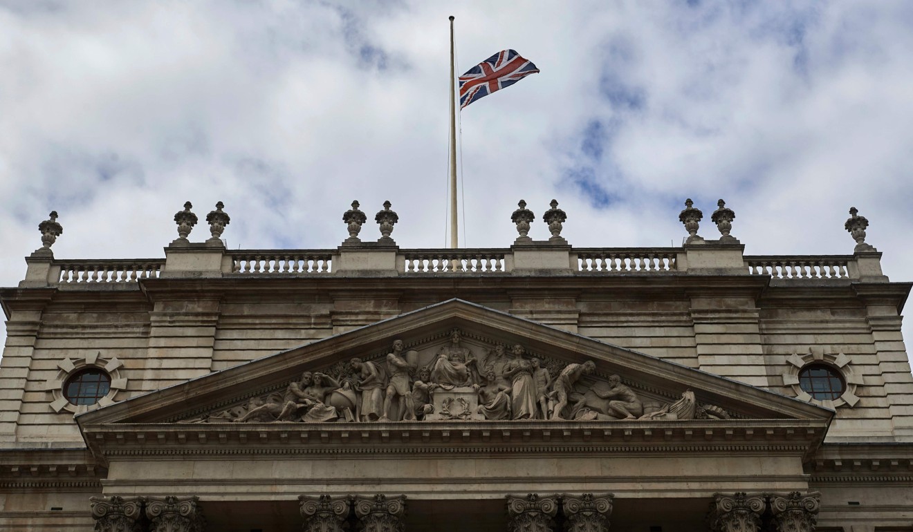 A flag flies at half-mast above the UK Treasury Office in London. Photo: AFP