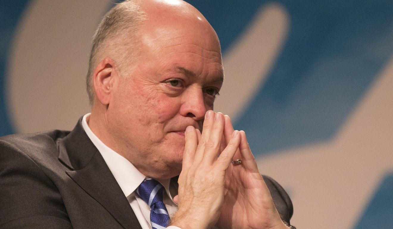 Ford newly appointed president and CEO Jim Hackett listens to questions from the media. Photo: EPA
