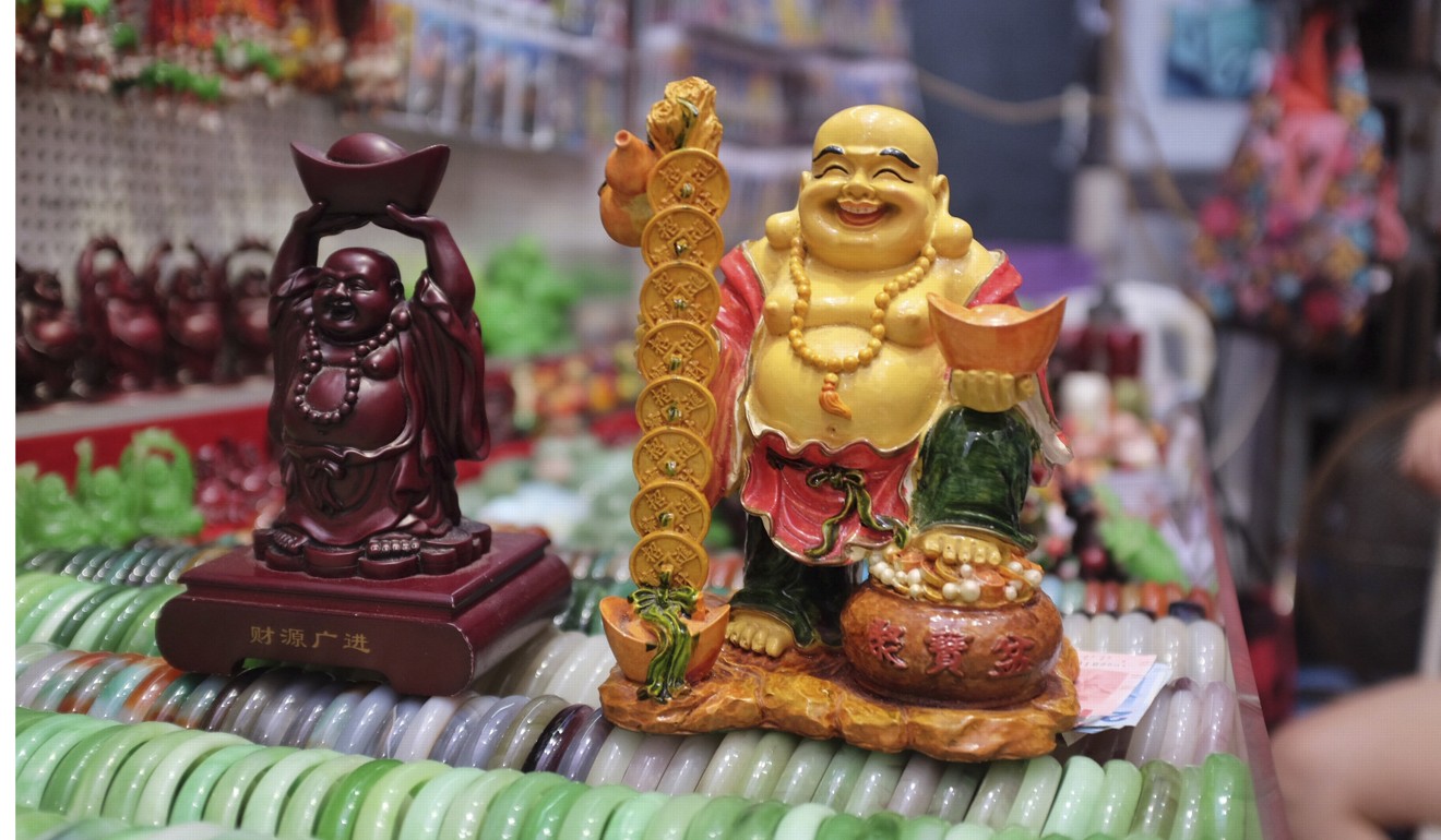 Shoppers can haggle down the price on all items at the markets, including these two happy Buddhas. Photo: Alkira Reinfrank