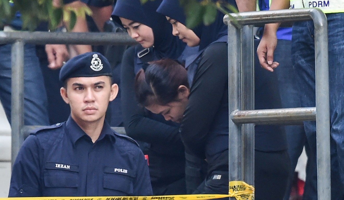 Indonesian national Siti Aisyah is escorted by Malaysian police. Photo: AFP
