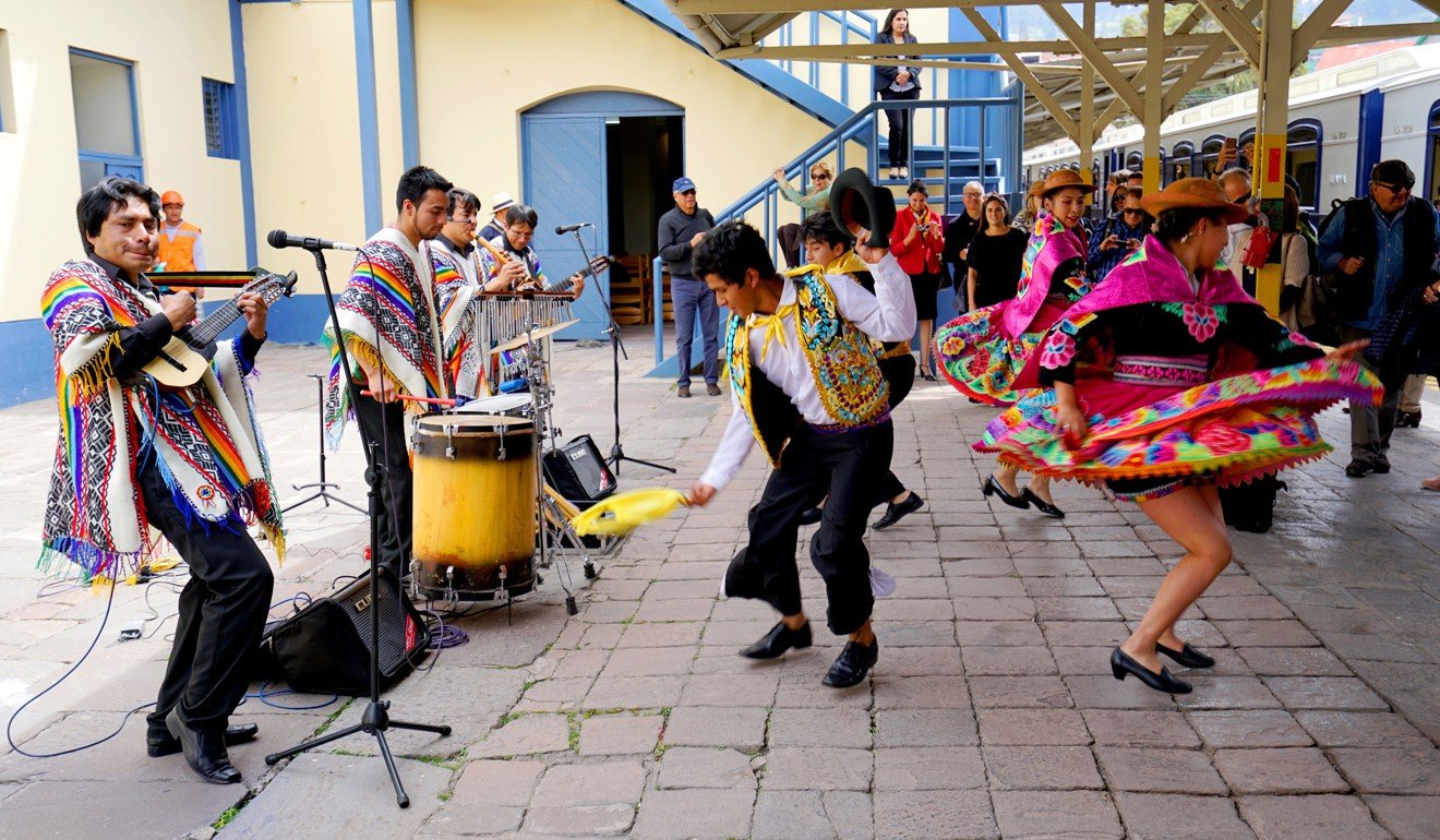 Local native musicians and dancers in traditional costumes welcome guests of the Andean Explorer. Photo: Marco Ruiz