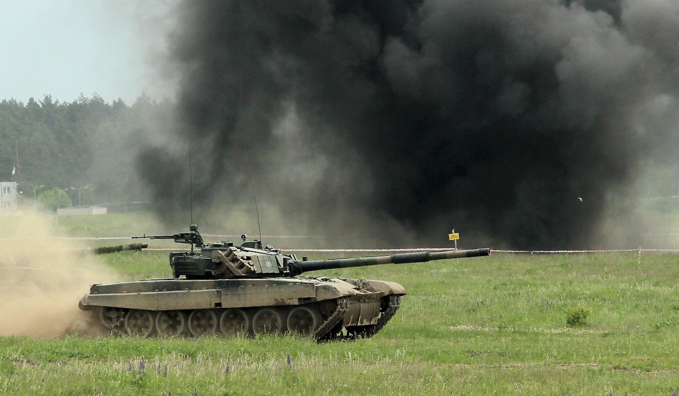 A tank rolls along in the Puma-17 military exercise in Orzysz, north east Poland. Photo: EPA