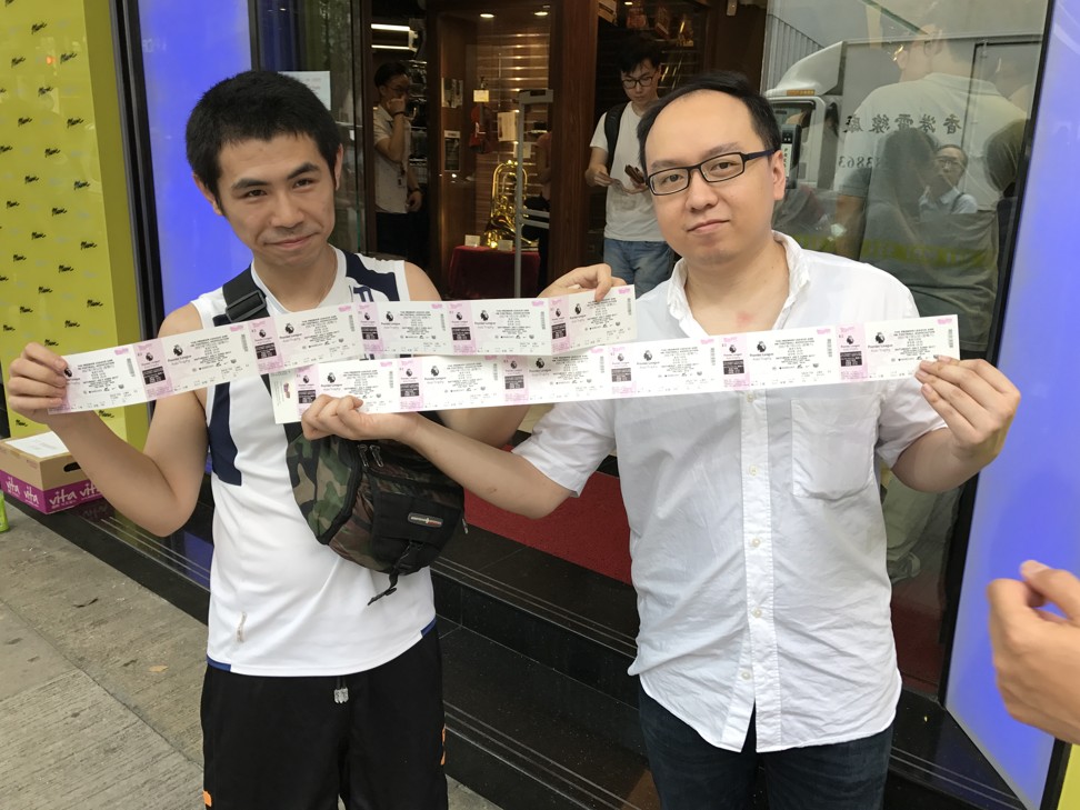 Mr Poon (right), a Liverpool fan, was the first to arrive in the queue to buy his tickets. Photo: Chan Kin-wa