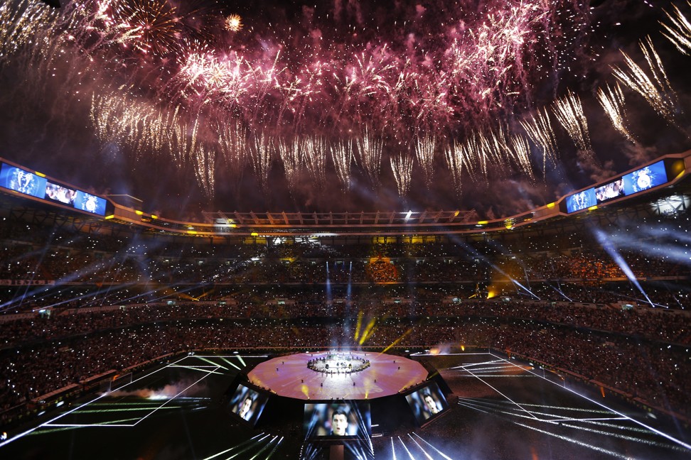Real Madrid supporters watch fireworks as the team celebrate. Photo: AP
