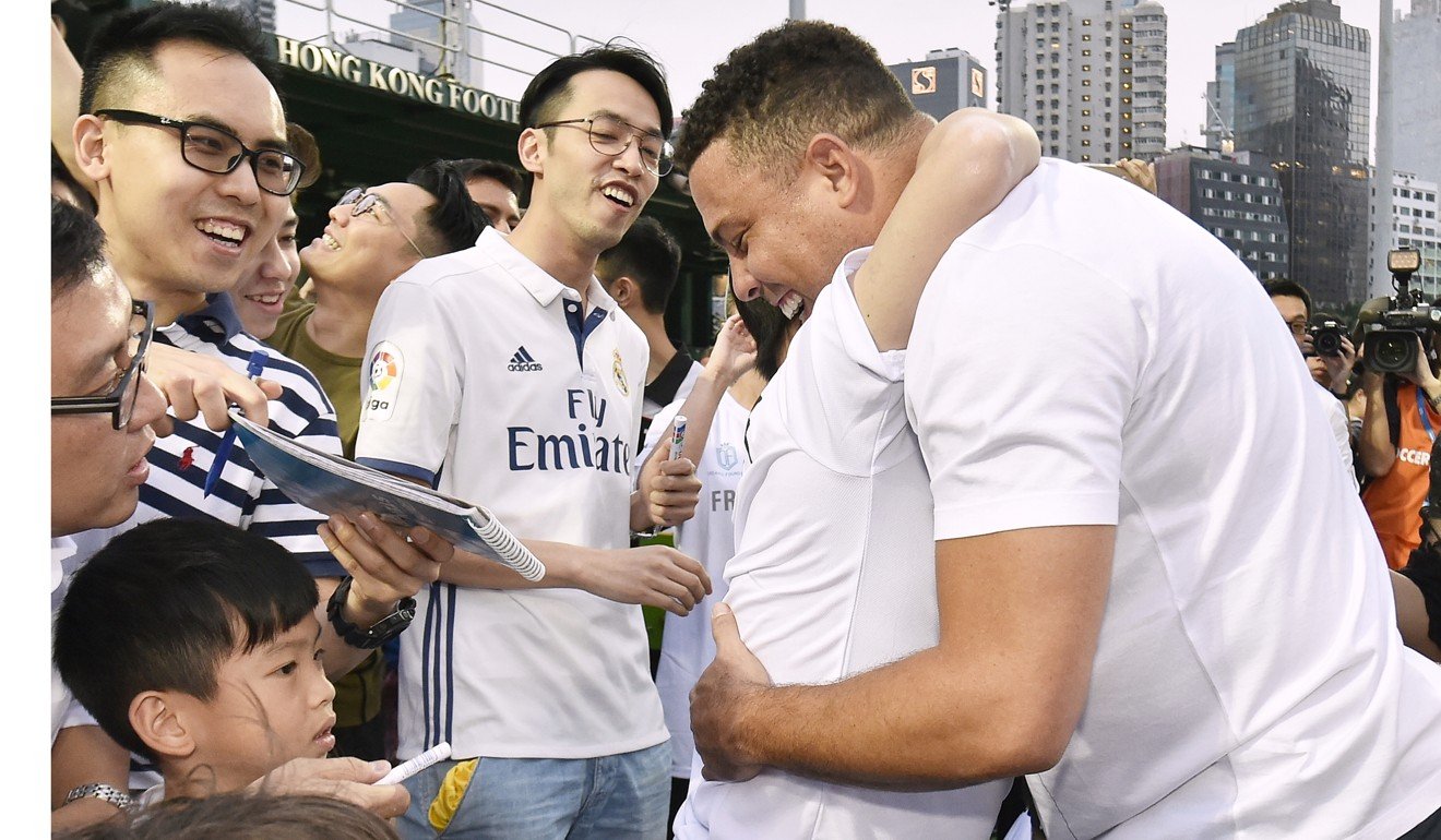Ronaldo hugs a fan at the clinic at the Hong Kong Football Club. Photo: Real Madrid Foundation