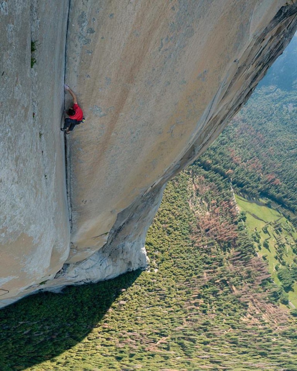 Alex Honnold, 600 metres above the valley floor in Yosemite National Park, about two-thirds of the way into his ascent of El Capitan without the aid of ropes or any gear beyond a bag of chalk and his rubber shoes. The awe-inspiring scene was captured by fellow climber and photographer Jimmy Chin. Photo: Jimmy Chin / Facebook