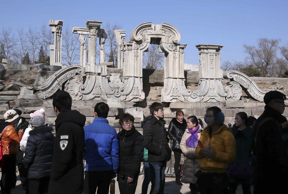 Tourists at the Guanshuifa fountain, part of the ruins of the Summer Palace, in Beijing, in 2014. Picture: AFP