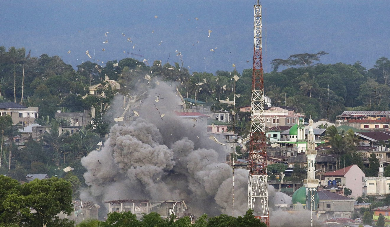 Philippine jets bomb suspected locations of Muslim militants in Marawi city. Photo: AP