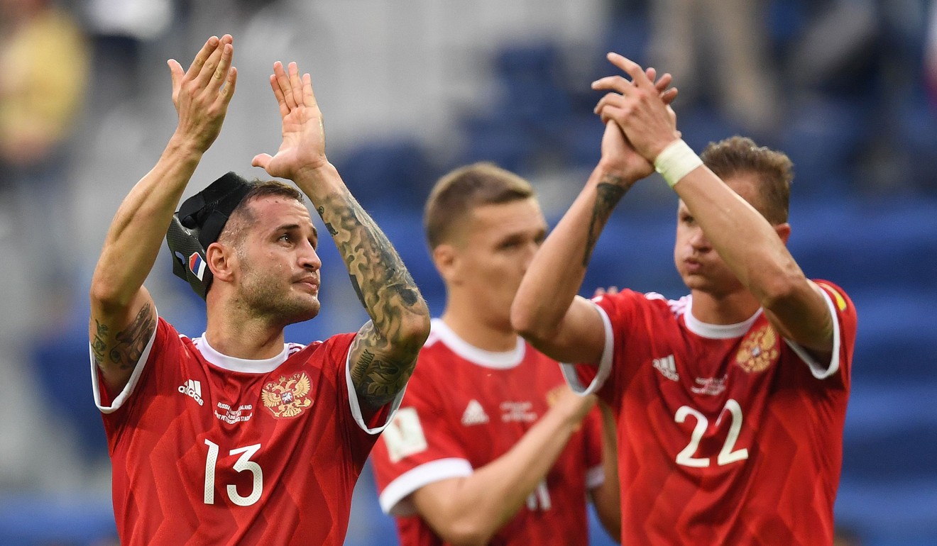 Fedor Kudryashov (left) and Dmitry Tarasov (right) acknowledge the Russia fans after their 2-0 win against New Zealand. Photo: AFP