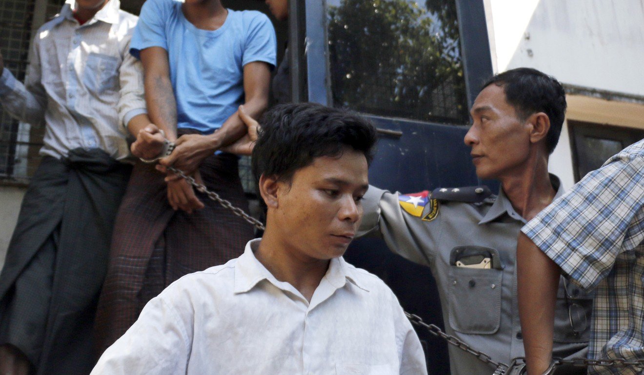 Self-styled exorcist Tun Naing (centre) arrives at a district court in Thanlyin township, south of Yangon. Photo: AP