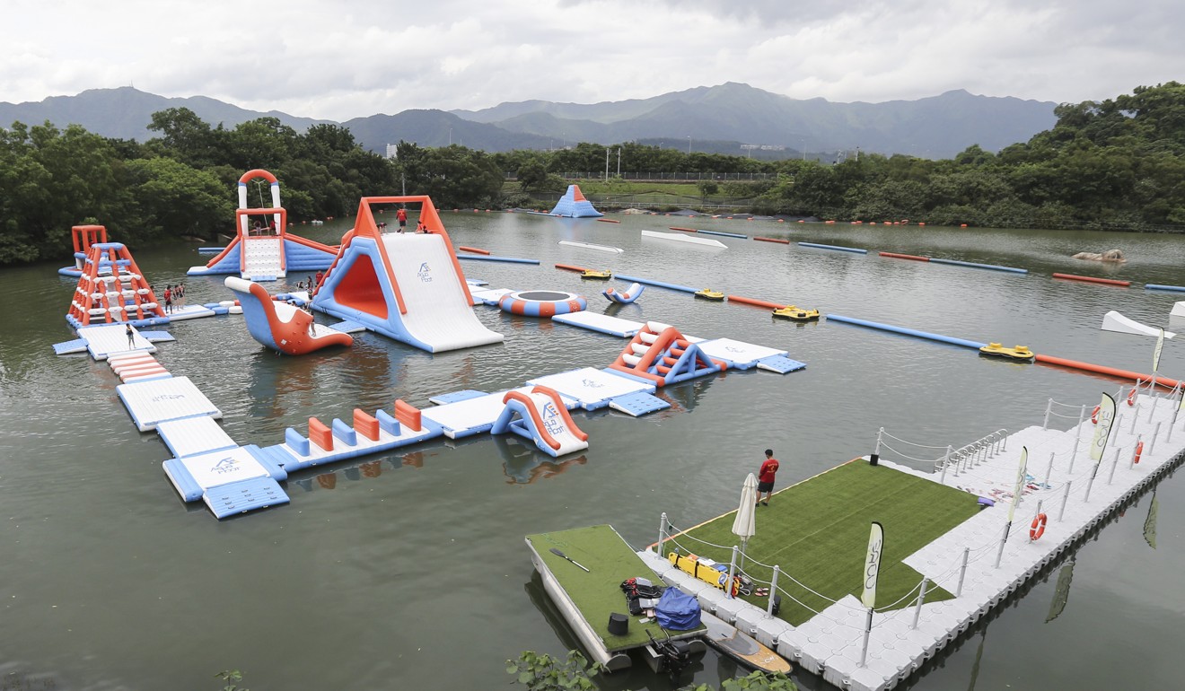 The park, set on a lake, has inflatables including a water slide. Photo: Dickson Lee