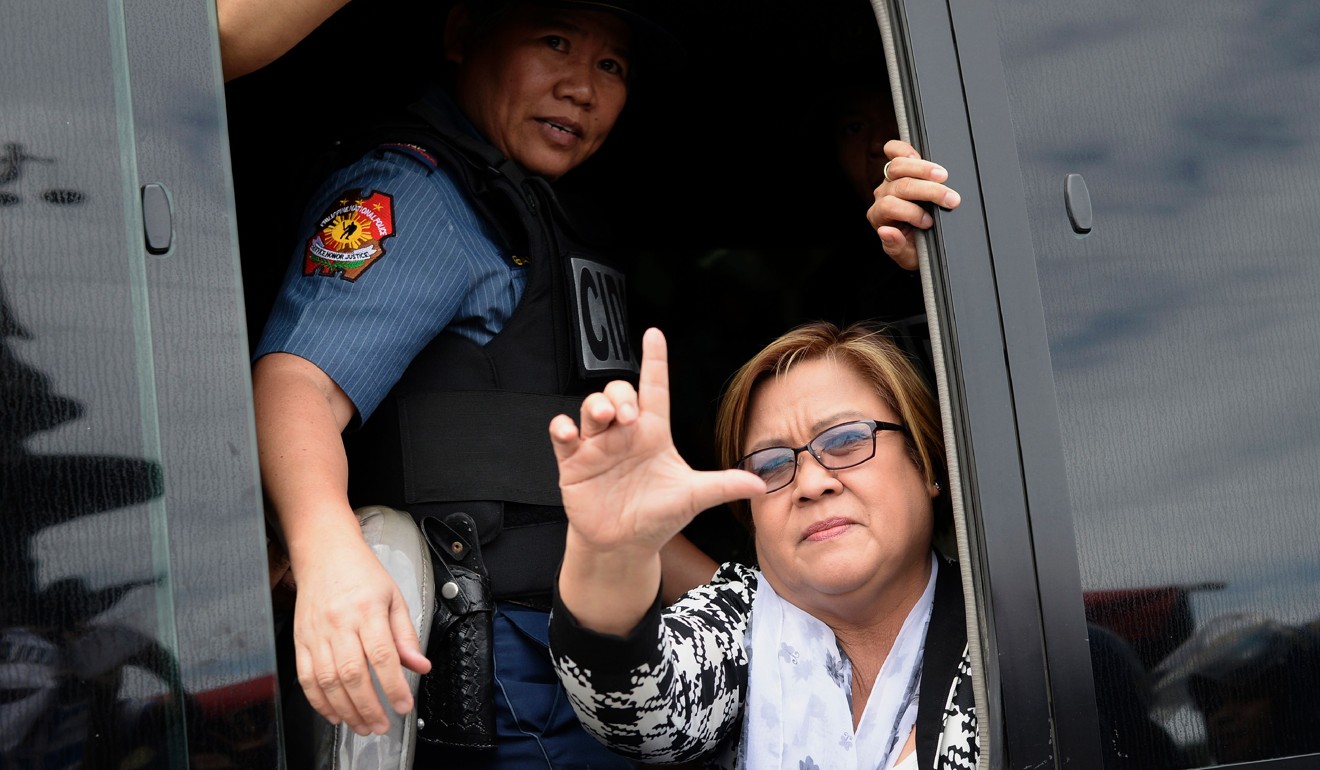 Philippine Senator Leila De Lima waves to her supporters after appearing at a court in Muntinlupa City, suburban Manila. Photo: AFP