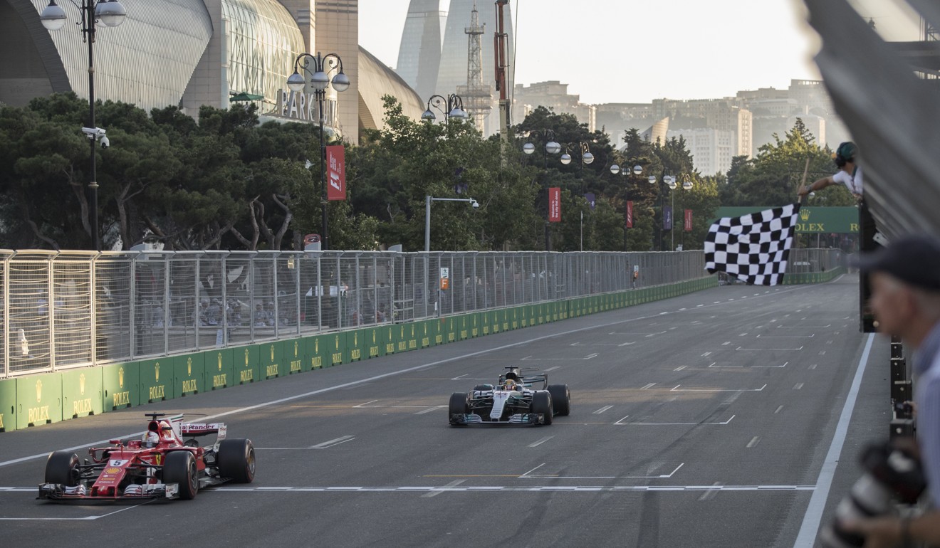 Sebastian Vettel (left) finishes ahead of Lewis Hamilton in Baku. Photo: AP