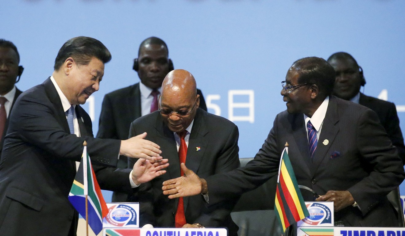 China's President Xi Jinping (left) shakes hands with Zimbabwe's President Robert Mugabe (right) while South Africa's President Jacob Zuma looks on at the Forum on China-Africa Cooperation in 2015. Photo: Reuters