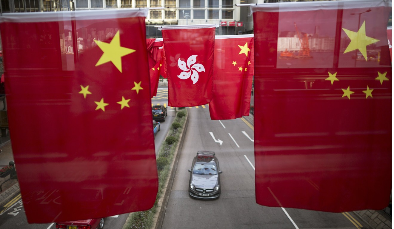 The hardest part of Carrie Lam’s job lies in improving Hong Kong’s relationship with the mainland. This requires a much deeper and broader effort than festooning the city with lanterns or national flags to celebrate the visit of President Xi Jinping. Photo: EPA