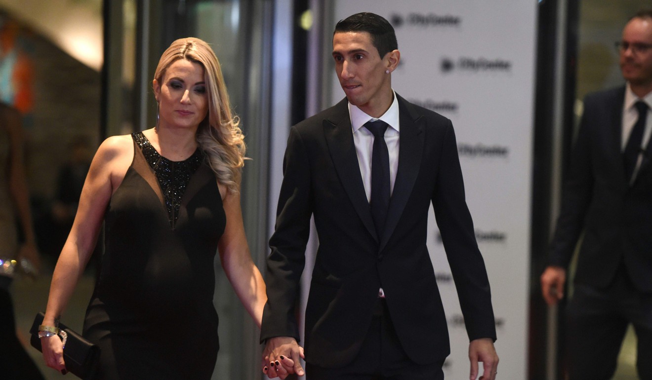 Paris Saint Germain's footballer Argentine Angel di Maria arrives with his wife. Photo: AFP