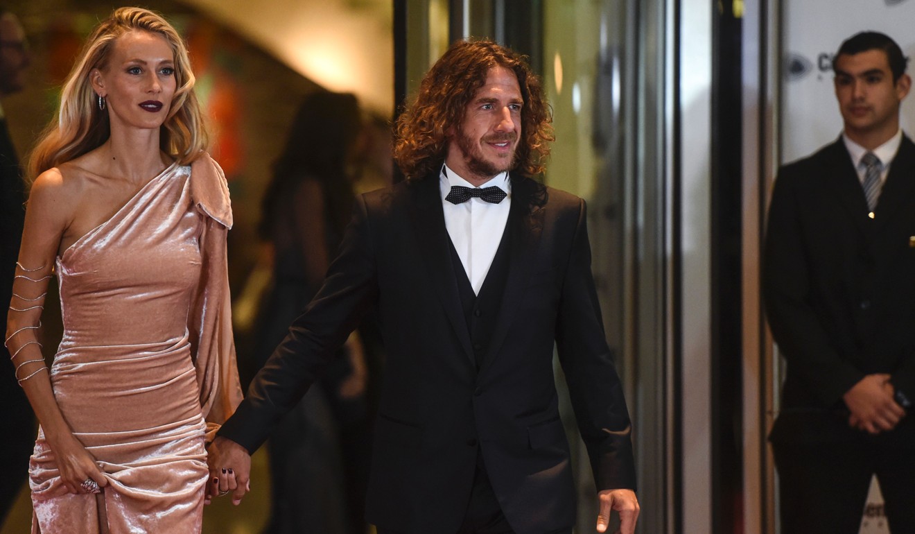 Former Barcelona player Carles Puyol and his wife. Photo: AFP